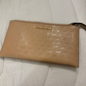 Michael Kors beige wristlet.